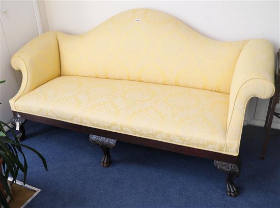 A mid 18th century style carved mahogany camel-back settee, W.210cm